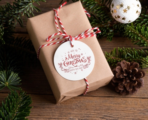 Wrapped gift with the label 'We Wish you Merry Christmas and Happy New Year'